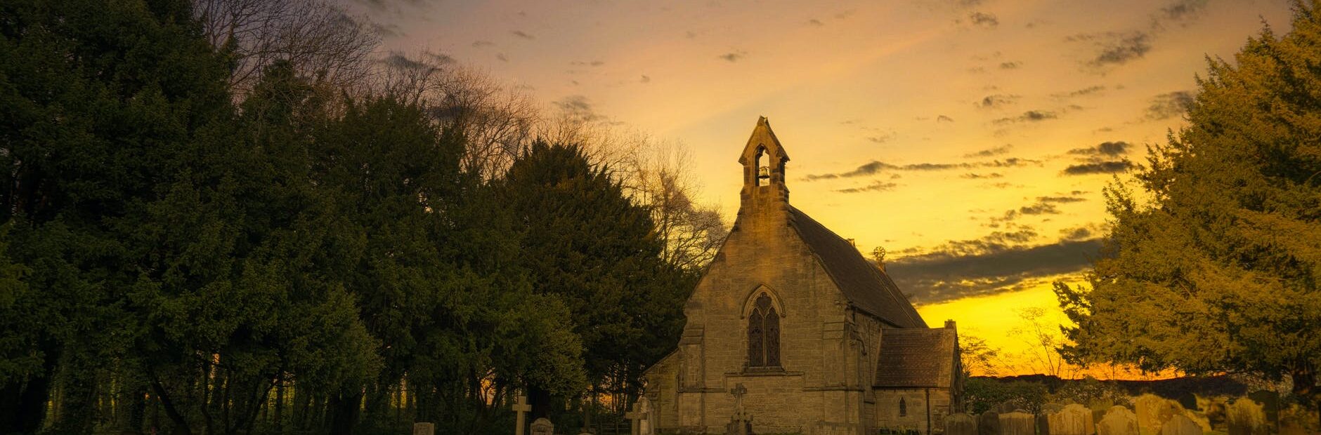 photo of brown concrete church during sunset
