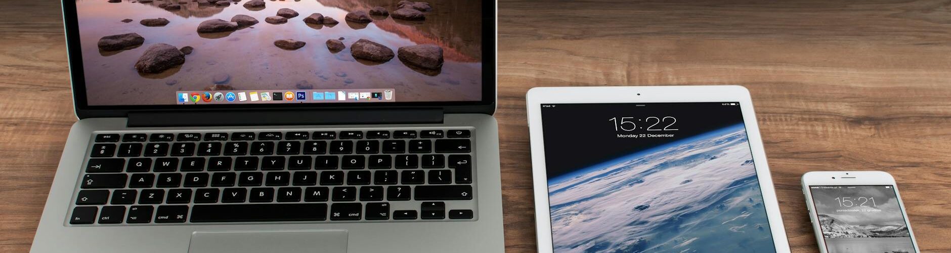 macbook pro beside white ipad