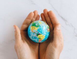 person holding a globe