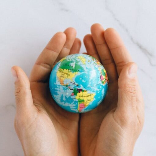 person holding a globe