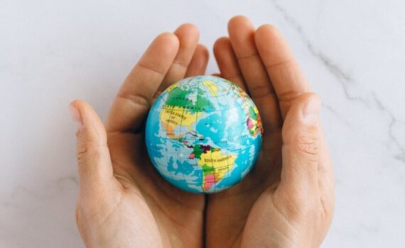 person holding a globe