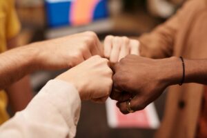 group of people with their fists together