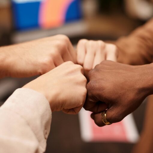 group of people with their fists together