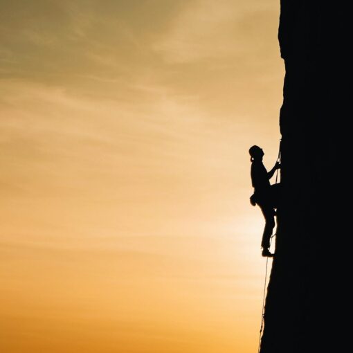 person rock climbing