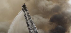 fireman on top of a ladder