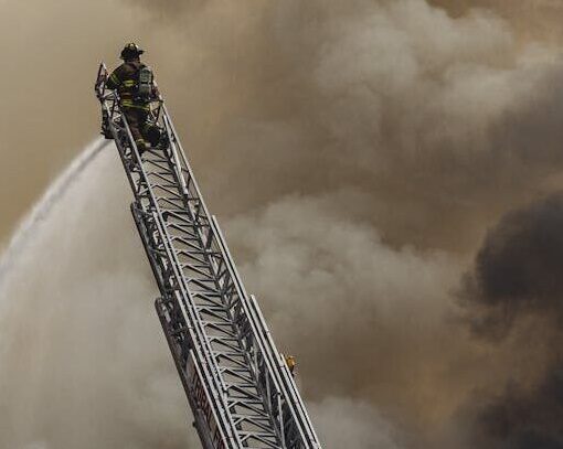 fireman on top of a ladder